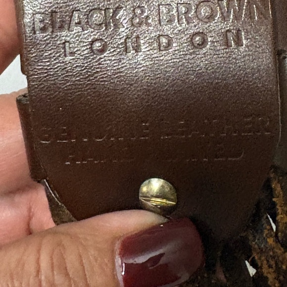 Black & Brown brown leather statement belt. Length is 43 inches. Large buckle.